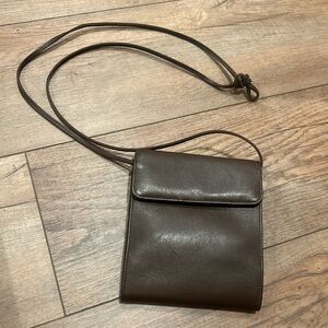 J.P. OURSE & CIE. Brown leather crossbody bag/organizer.  Multiple pockets